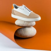 Brown and off-white sneakers — right view on rocks (thumbnail)